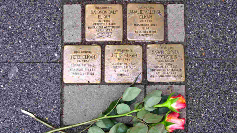 Brass bricks known as Stolperstein, or "stumbling stones," in front of a home in Raesfeld, Germany, where five members of a single family were forcibly removed by the Nazis. Across Germany, the stones commemorate the millions of victims of the Nazi regime.
