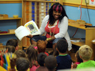 Kimberly Payton, a teacher at the Small Savers Child Development Center, reads to a group of preschoolers in Washington, D.C., in 2010. Researchers say that teachers who make small changes in how they read to 4-year-olds can improve kids' reading skills later on. Kimberly Payton, a teacher at the Small Savers Child Development Center, reads to a group of preschoolers in Washington, D.C., in 2010. Researchers say that teachers who make small changes in how they read to 4-year-olds can improve kids' reading skills later on.