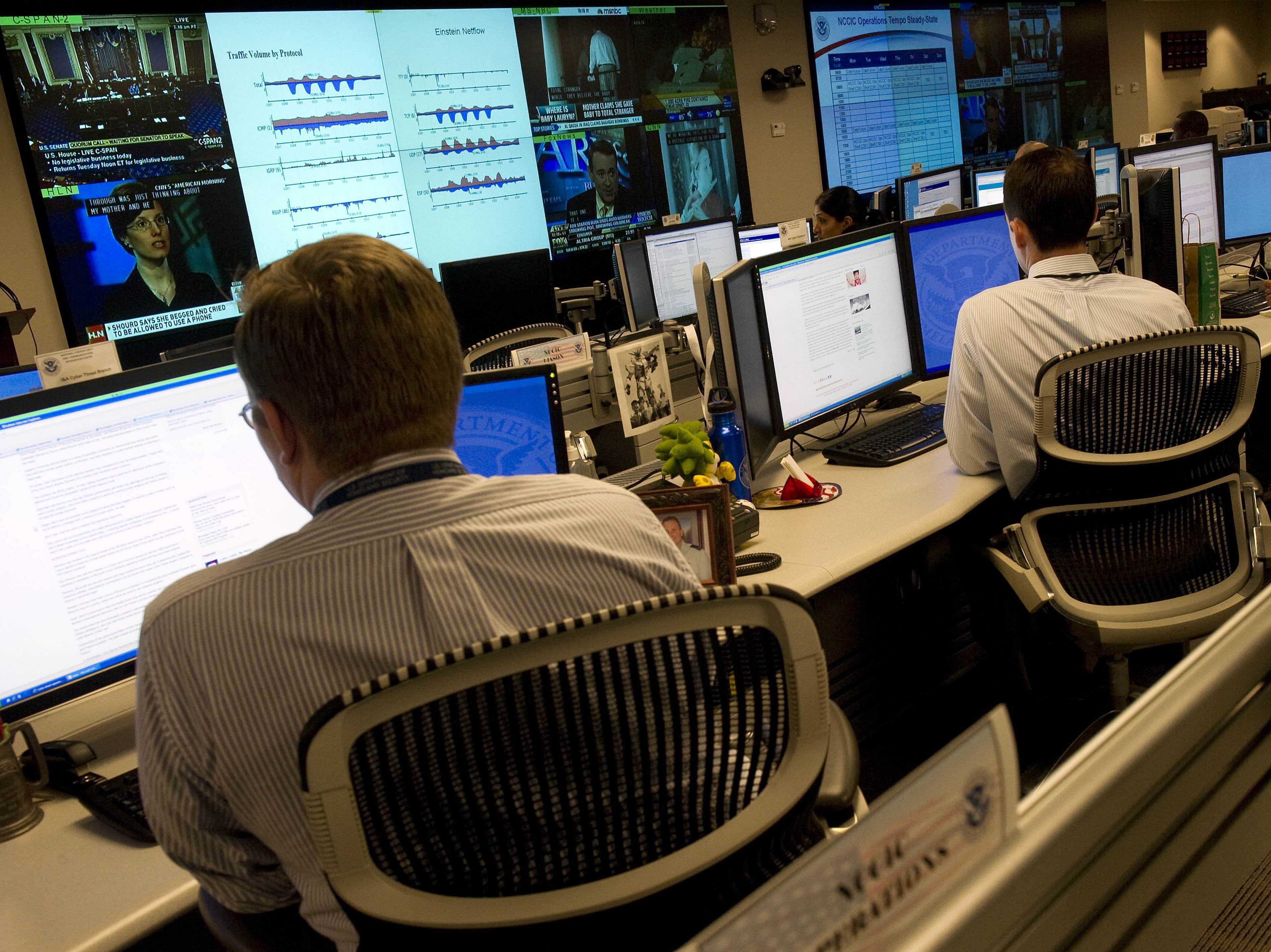 Homeland Security analysts watch for threats to U.S. technological infrastructure at the National Cybersecurity and Communications Integration Center. (Image credit: AFP/Getty Images)