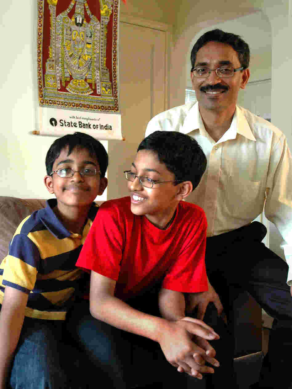 Arvind (center) and his younger brother, Srinath, spend hours tediously going through the dictionary.