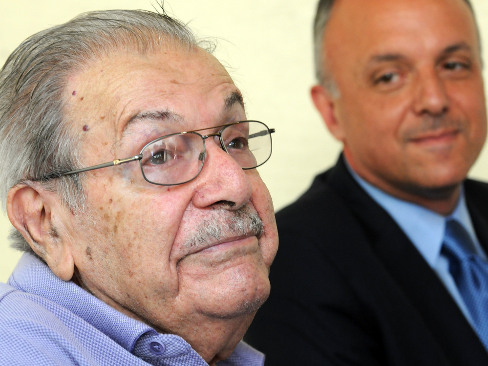 Bill Internicola, a 91-year-old veteran of World War II, was one of the voters targeted by Florida as a potential noncitizen. Internicola was ordered to prove his citizenship or lose the right to vote. He is flanked by U.S. Rep. Ted Deutch, who called on Florida Gov. Rick Scott to stop the purge of voter rolls immediately.