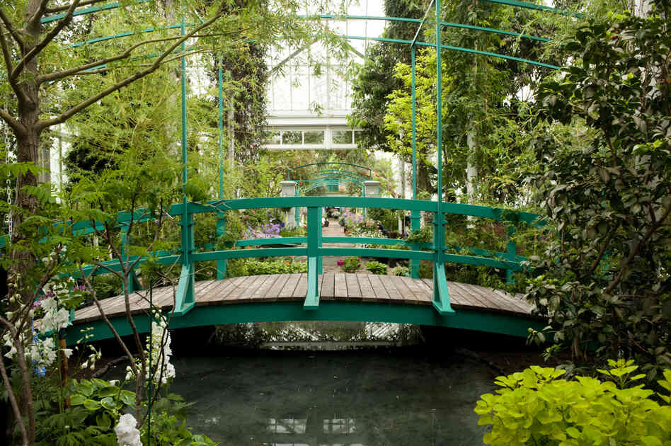The Japanese footbridge from Claude Monet's garden in Giverny, France, has been recreated inside the New York Botanical Garden's Bronx conservatory.