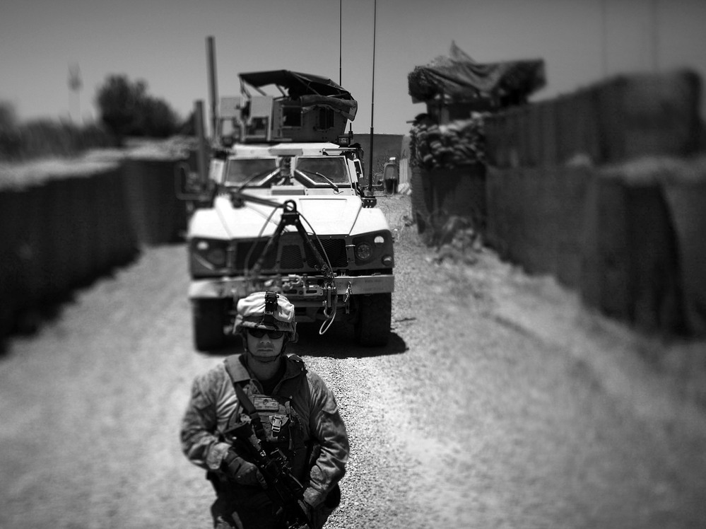 Marines with Echo Company of the Second Battalion, Ninth Marines out of Camp Lejeune, guide their M-ATV, a Mine Resistant Ambush Protected vehicle in to the district government compound in Marjah, Afghanistan.