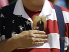A demonstrator holds a copy of the U.S. Constitution to his chest as he attends a protest in downtown San Antonio on March 23. A demonstrator holds a copy of the U.S. Constitution to his chest as he attends a protest in downtown San Antonio on March 23.