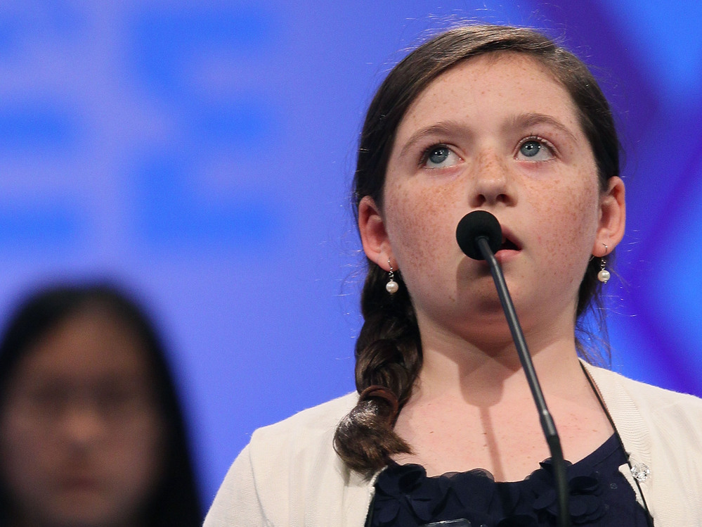 Kitty Shortt spells a word correctly during the third round of the 2012 Scripps National Spelling Bee yesterday.