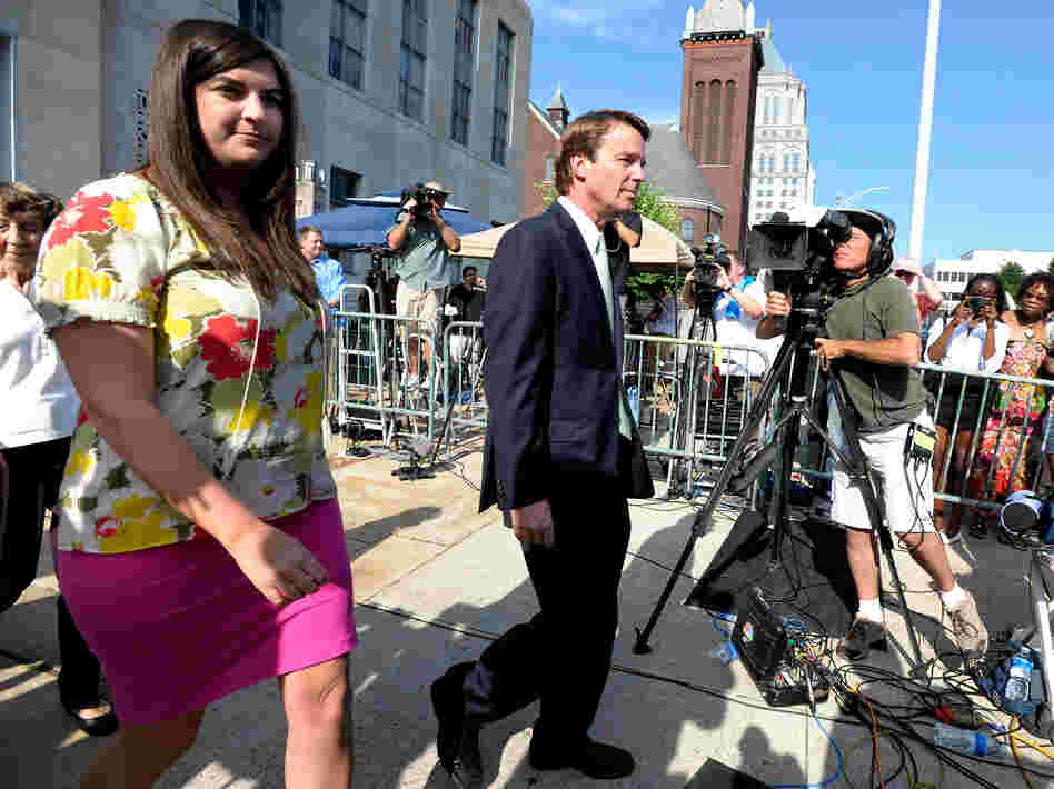 Former Democratic U.S. Sen. John Edwards (center) and his daughter Cate Edwards leave the federal court Thursday.