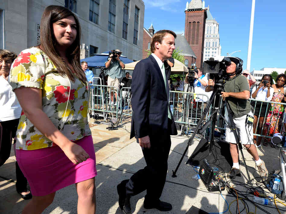 Former Democratic U.S. Sen. John Edwards (center) and his daughter Cate Edwards leave the federal court Thursday.