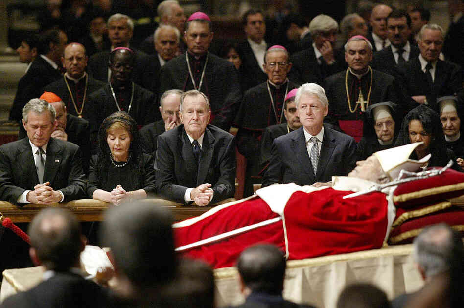 Former presidents often gather for significant events, such as funerals of heads of state and other major figures. Here, President George W. Bush, his wife Laura, former President George H.W. Bush, former President Bill Clinton, and Secretary of State Condoleezza Rice kneel by the body of Pope John Paul II inside St. Peter's Basilica, at the Vatican, on April 6, 2005.