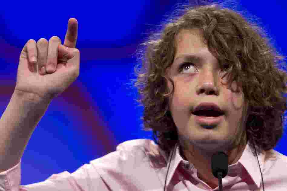 Sam Lowery, of Charlestown, Mass., spells his word in the air during Round 2 of the National Spelling Bee in Oxon Hill, Md., on Wednesday.
