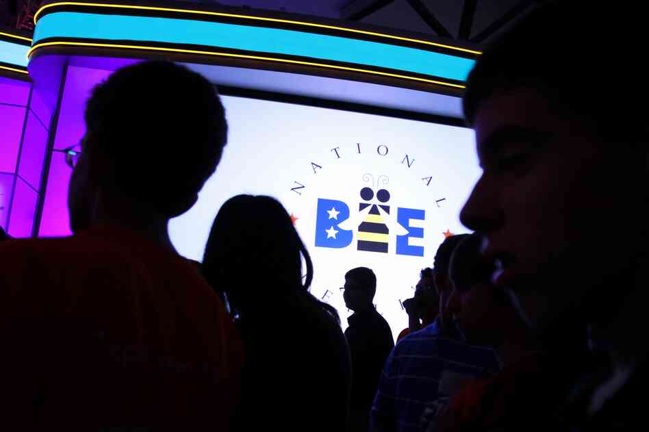 Spelling contestants walk back onto the stage for the third round of the National Spelling Bee in Oxon Hill, Md., on Wednesday.