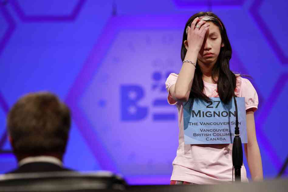 Mignon Tsai, 12, of Abbotsford, British Columbia, Canada, reacts as she misspells a word during Round 5 of the semifinals on Thursday.