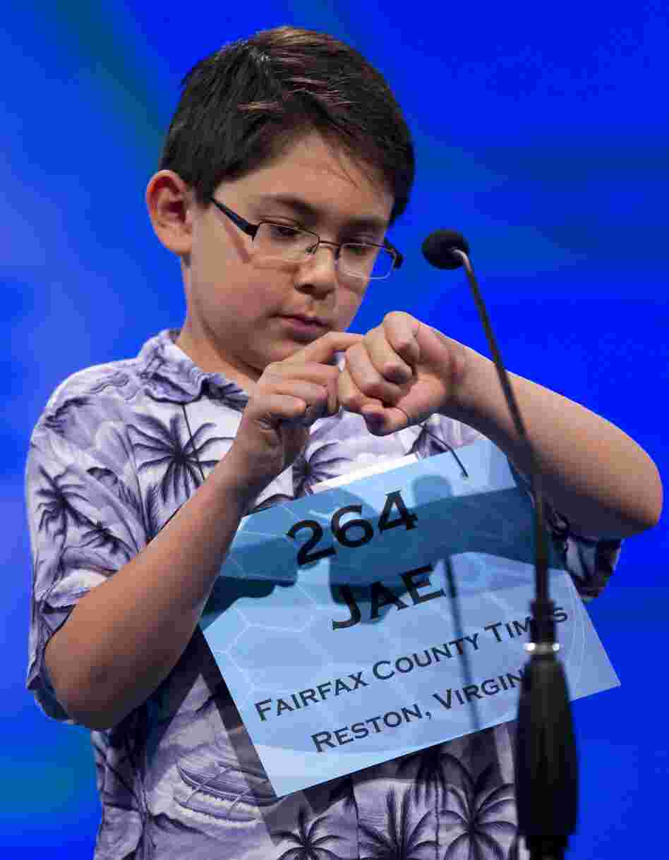 Jae Canetti of Fairfax, Va., concentrates on his word "habendum" during the semifinal round on Thursday.