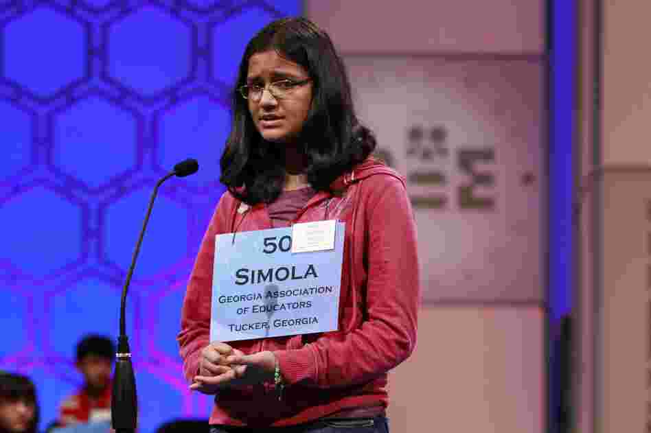 Despite looking nervous, Simola Nayak, 13, of DeKalb County, Ga., spells a word correctly in Round 5 of the semifinals on Thursday.
