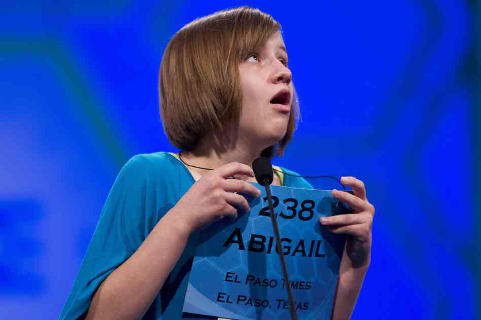 Abigail Violet Spitzer of El Paso, Texas, reacts after spelling her word "tondino" correctly during Thursday's semifinal round.