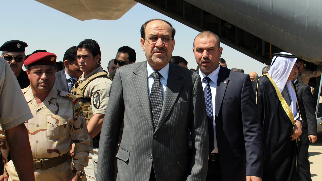 Iraqi Prime Minister Nouri al-Maliki (center) arrives on May 8 at Kirkuk airport in northern Iraq, on his first visit to the multi-ethnic city since taking office.