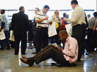 Aaron Moore completes a job application at a Los Angeles career fair on Thursday. Job growth has slowed sharply since the winter, the government said Friday. Aaron Moore completes a job application at a Los Angeles career fair on Thursday. Job growth has slowed sharply since the winter, the government said Friday.