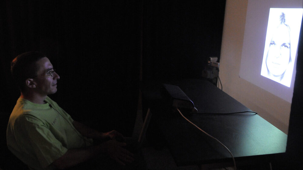 Jeff Hudale, who is autistic, demonstrates a face recognition test at the University of Pittsburgh in 2010. Researchers use eye tracking devices to monitor and record what he is looking at.