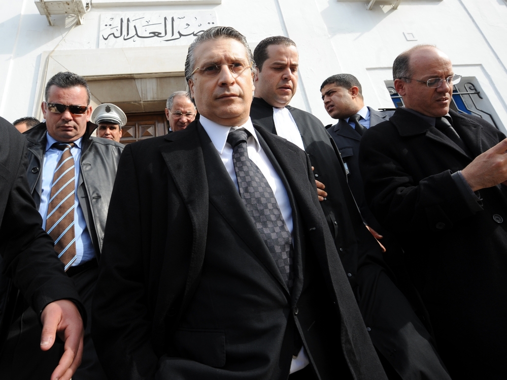 Nabil Karoui, the director of the private Tunisian TV channel Nessma, had his offices and home attacked after his channel broadcast a film that angered Islamists. Karoui, shown here leaving a courthouse in Tunis, lost a case for "violating morals."