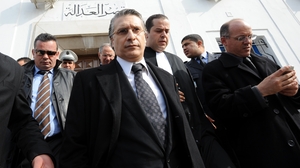Nabil Karoui, the director of the private Tunisian TV channel Nessma, had his offices and home attacked after his channel broadcast a film that angered Islamists. Karoui, shown here leaving a courthouse in Tunis, lost a case for "violating morals."