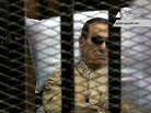 An image grab taken from Egyptian state TV shows ousted Egyptian president Hosni Mubarak sitting inside a cage in a courtroom during his verdict hearing in Cairo Saturday. An image grab taken from Egyptian state TV shows ousted Egyptian president Hosni Mubarak sitting inside a cage in a courtroom during his verdict hearing in Cairo Saturday.