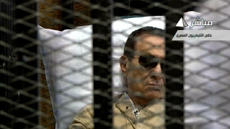 An image grab taken from Egyptian state TV shows ousted Egyptian president Hosni Mubarak sitting inside a cage in a courtroom during his verdict hearing in Cairo Saturday. An image grab taken from Egyptian state TV shows ousted Egyptian president Hosni Mubarak sitting inside a cage in a courtroom during his verdict hearing in Cairo Saturday.