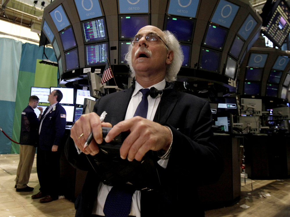 Trader Peter Tuchman works on the floor of the New York Stock Exchange at the close of trading Friday. The stock market suffered its worst day of the year after a surprisingly weak jobs report.