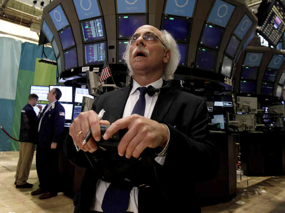 Trader Peter Tuchman works on the floor of the New York Stock Exchange at the close of trading Friday. The stock market suffered its worst day of the year after a surprisingly weak jobs report.