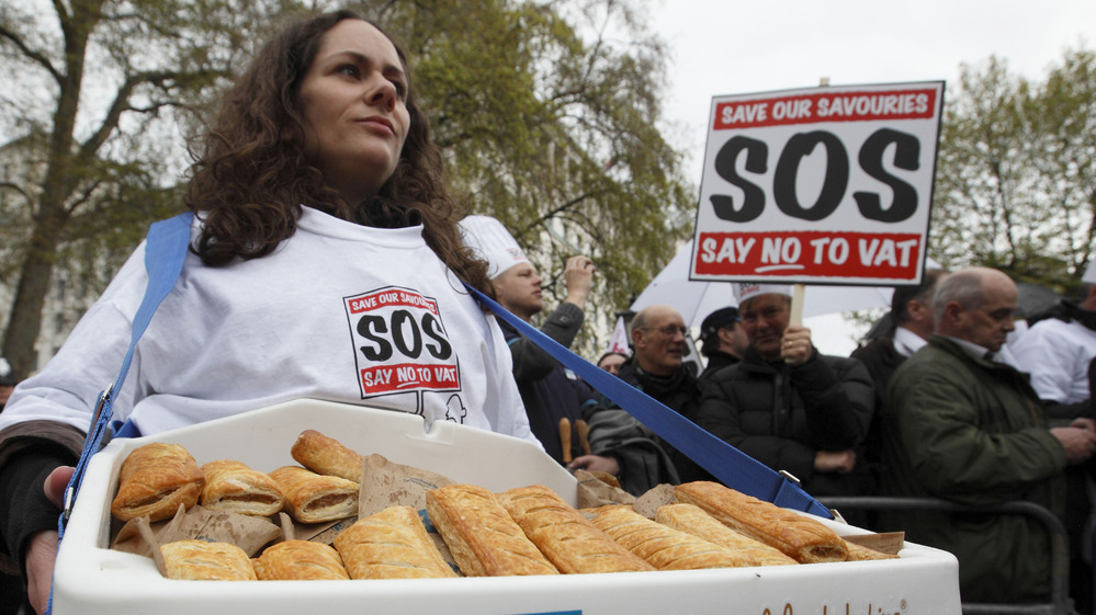 Protesters gather outside Downing Street in London to deliver a petition against the so-called "pasty tax," a government bid to levy 20 percent tax on hot takeaway food.