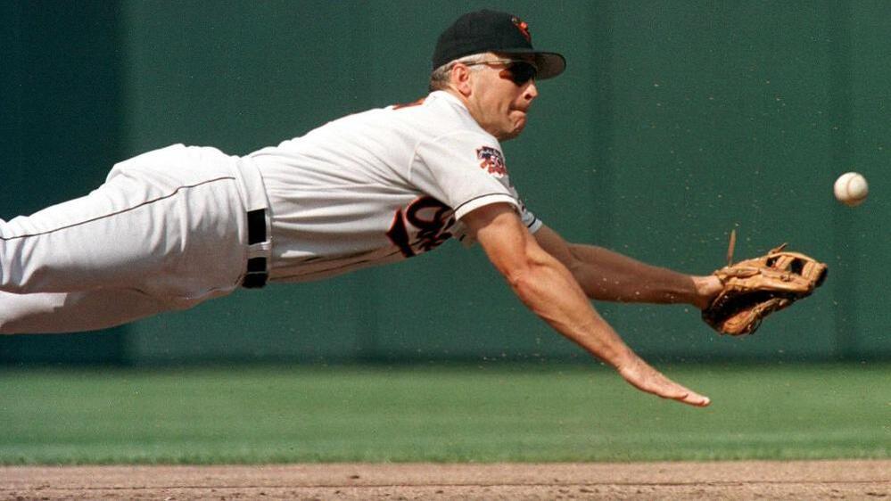 Baltimore Oriole Cal Ripken Jr. dives for a ball during a game against the Cleveland Indians on Sept. 15, 1997.