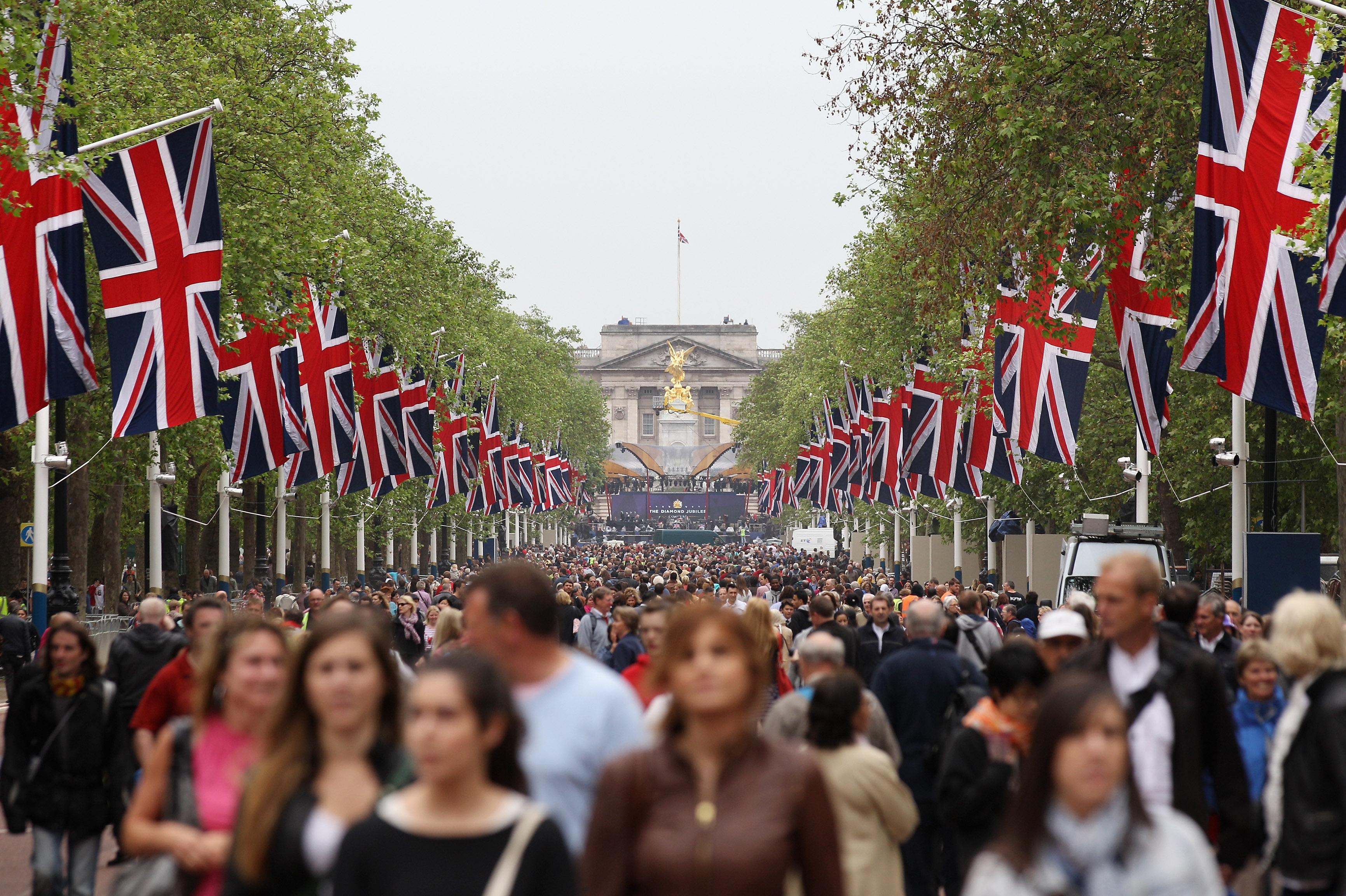 Members of the public walk along The Mall, which is closed to traffic for the Diamond Jubilee weekend in London.
