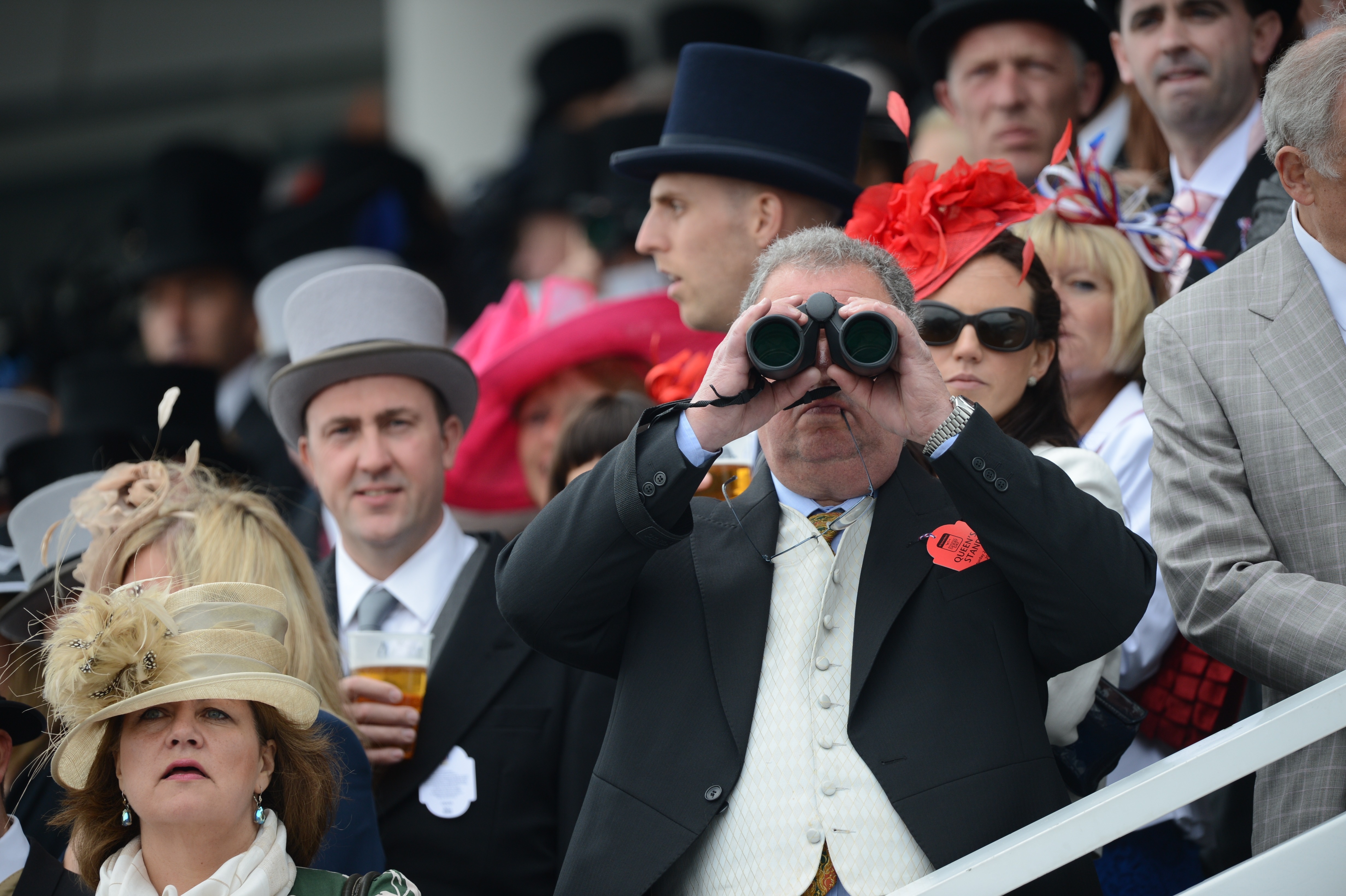Racegoers attend Derby Day, the second day of the Epsom Derby horse racing festival, on Saturday.