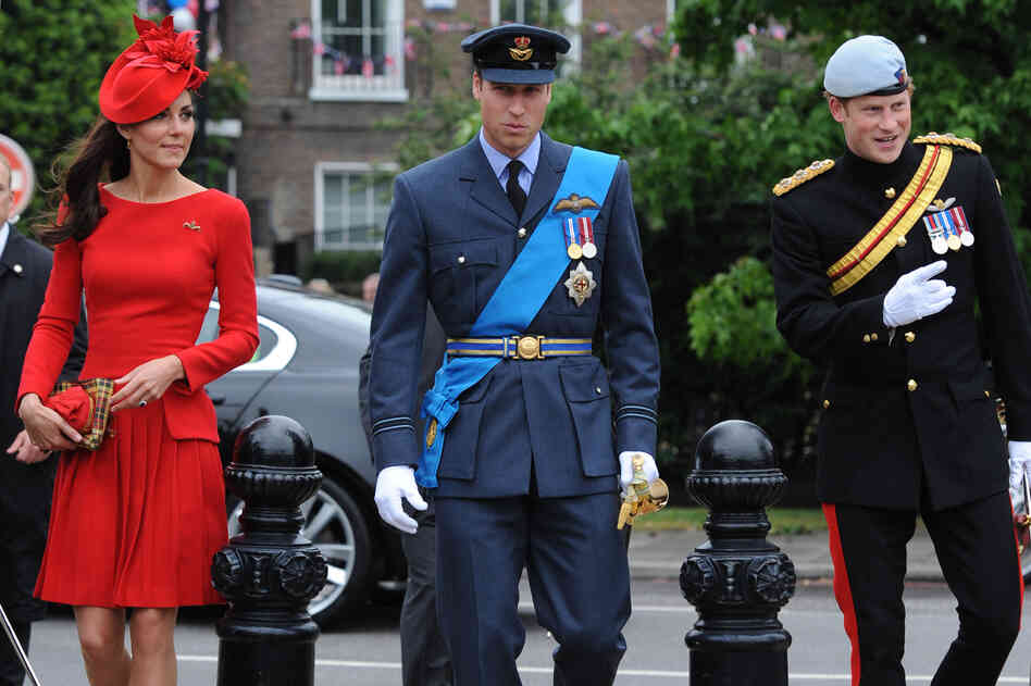 The queen's grandson Prince William and his wife, the Duchess of Cambridge — he in his Royal Air Force uniform, she in a red Alexander McQueen dress — and William's brother, Prince Harry, were among senior royals who joined the queen and her husband, Prince Philip.