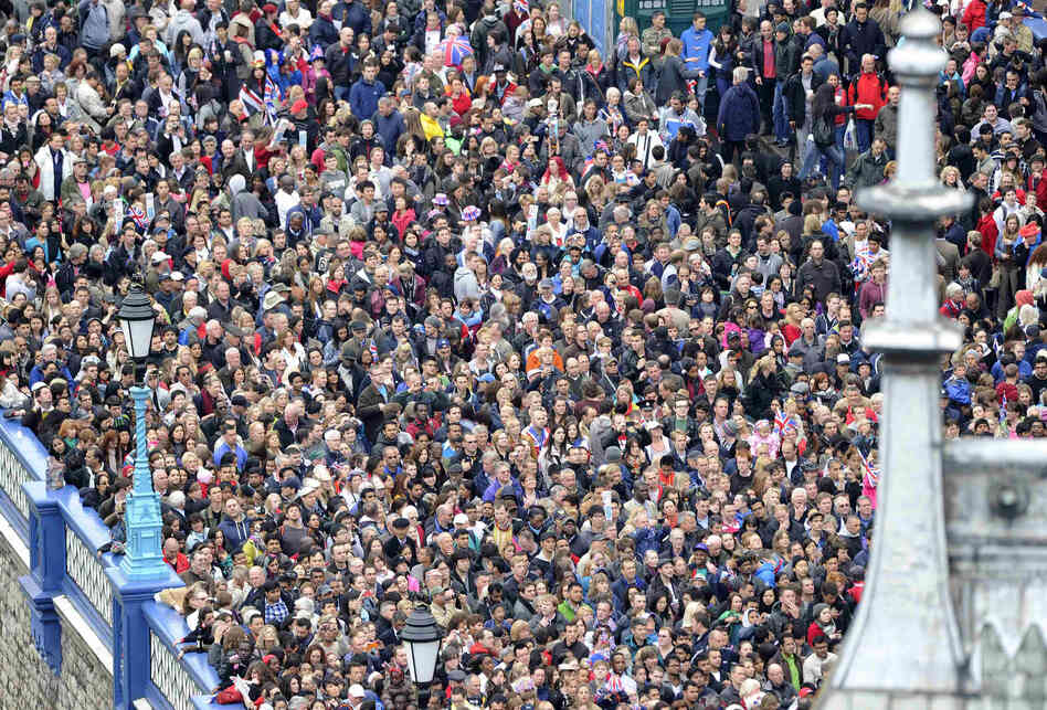 Large crowds turned out despite cold, drizzly weather to fete a queen who has assumed the status of nation's grandmother.
