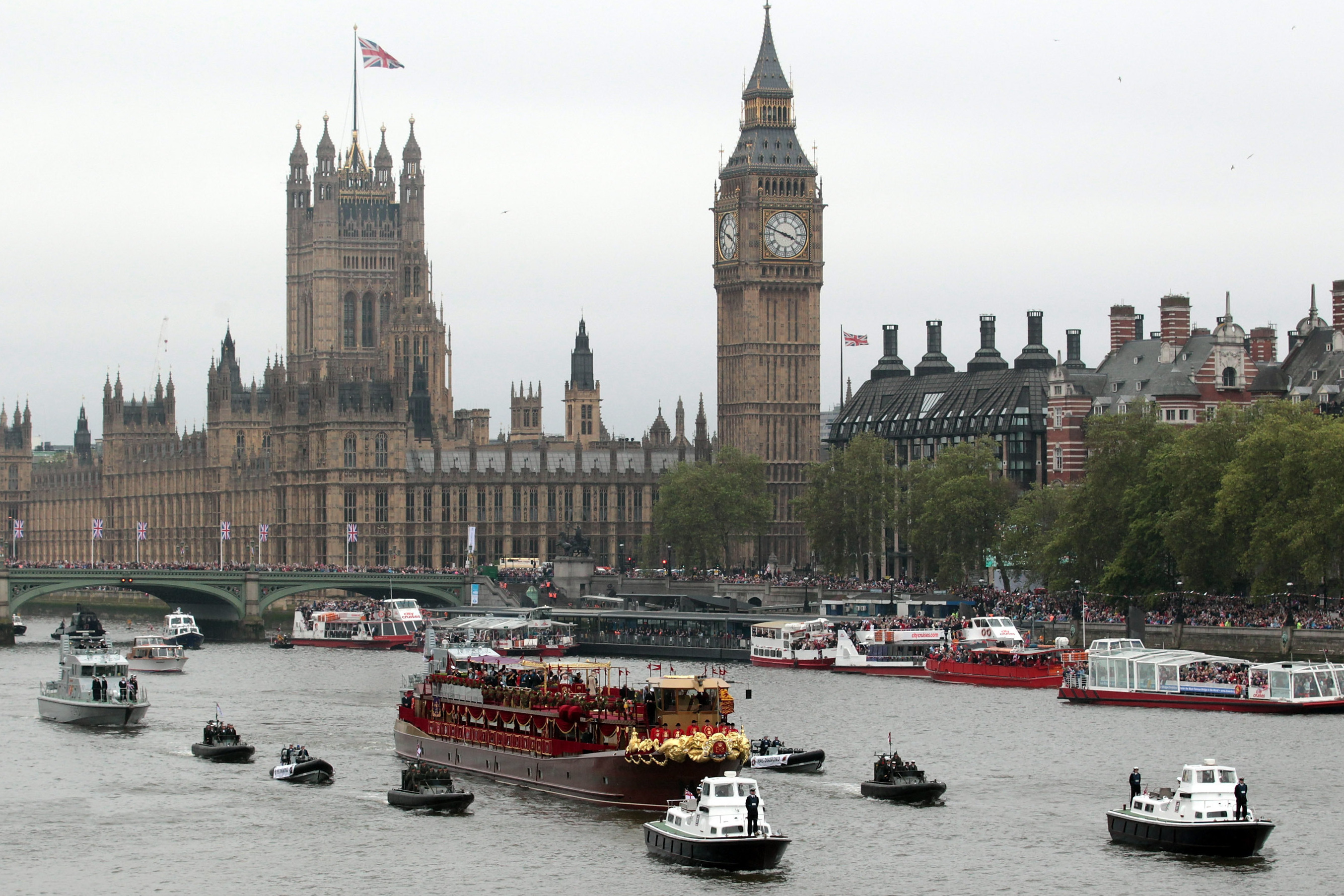 Queen Elizabeth II sailed down the River Thames on Sunday amid a motley but majestic flotilla of 1,000 vessels, mustered to mark her 60 years on the British throne.