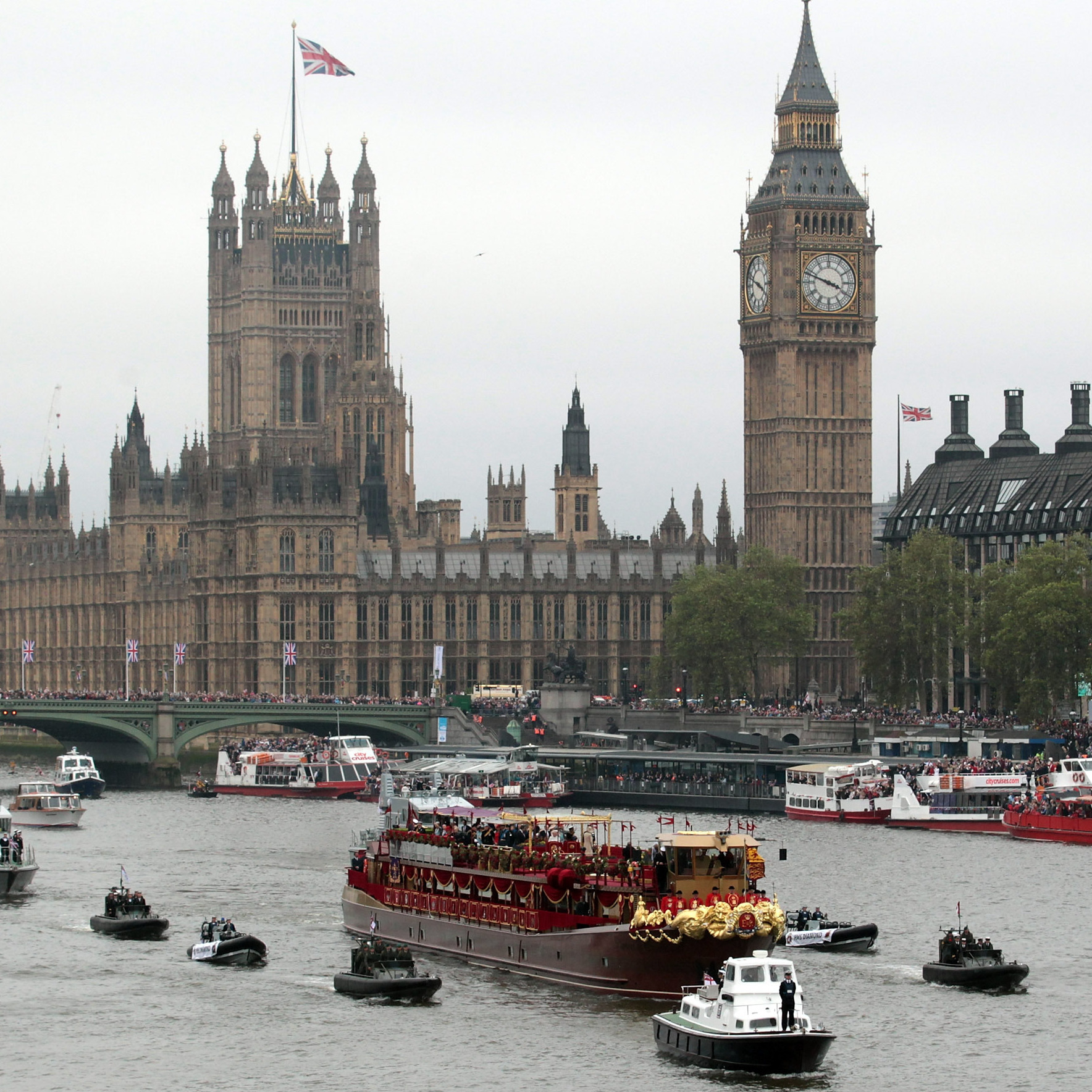 Thousands crowded the banks of the Thames today to catch a glimpse of Queen Elizabeth leading a flotilla of a thousand boats to mark her 60-year reign.