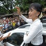 Myanmar democracy icon Aung San Suu Kyi waves to Myanmar refugees during her visit to the Mae La refugee camp near the Thai-Myanmar border on Saturday.