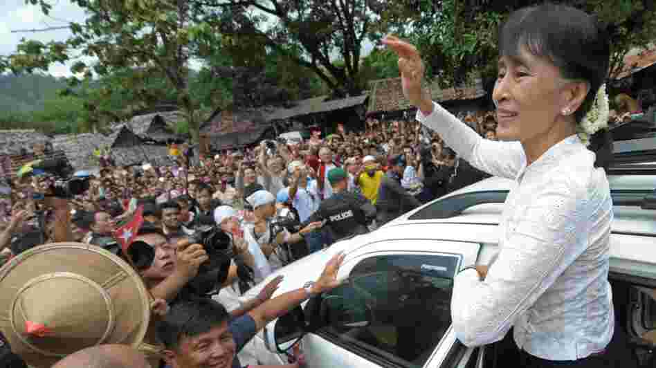 Myanmar democracy icon Aung San Suu Kyi waves to Myanmar refugees during her visit to the Mae La refugee camp near the Thai-Myanmar border on Saturday.