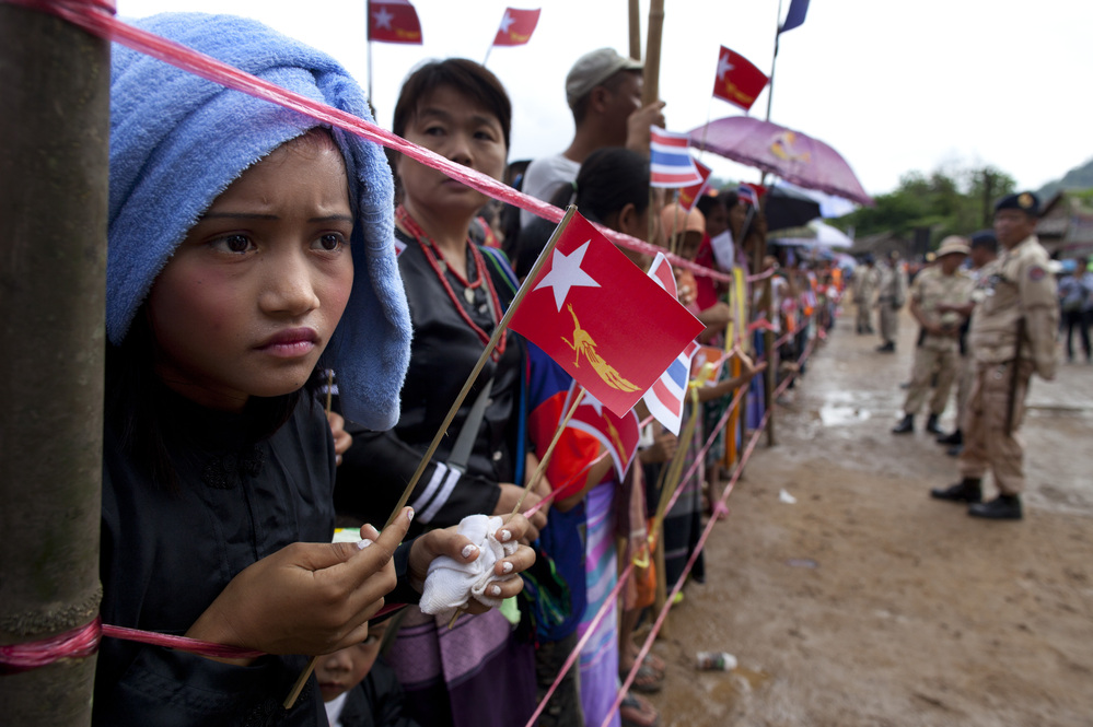 Ethnic Karen refugees waited hours for Suu Kyi to arrive at the Mae La refugee camp.