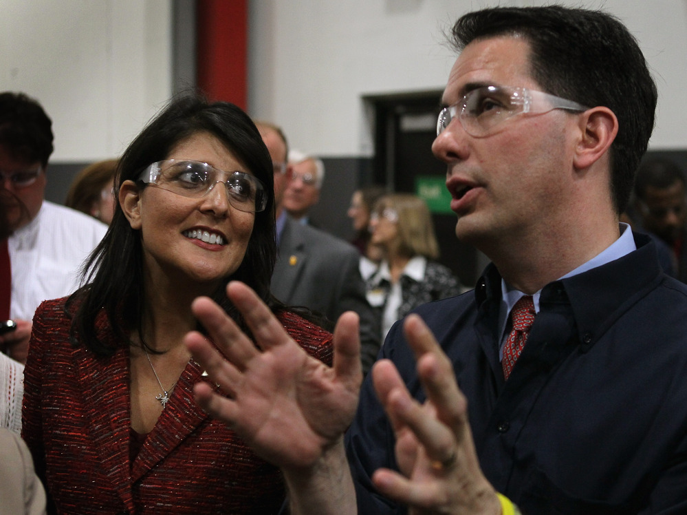South Carolina Gov. Nikki Haley and Wisconsin Gov. Scott Walker tour Quad Graphics during a campaign stop for Walker in Sussex, Wis., last week.