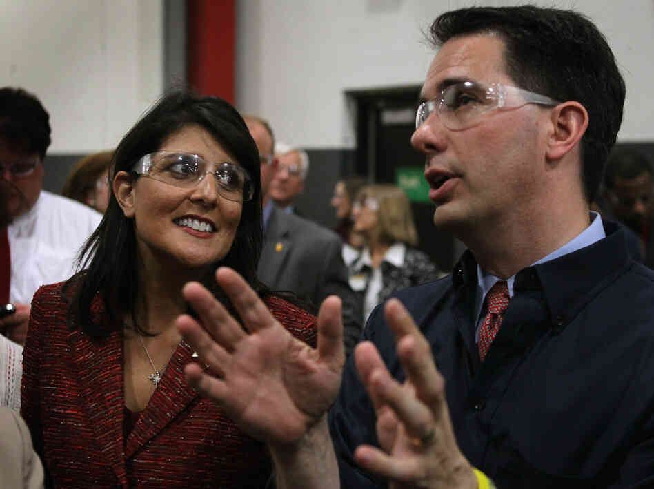 South Carolina Gov. Nikki Haley and Wisconsin Gov. Scott Walker tour Quad Graphics during a campaign stop for Walker in Sussex, Wis., last week.