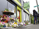 A memorial outside Seattle's Cafe Racer on Thursday, a day after a deadly shooting inside. Just a few days later, musicians gathered outside the coffeehouse for an improvised memorial jam session. A memorial outside Seattle's Cafe Racer on Thursday, a day after a deadly shooting inside. Just a few days later, musicians gathered outside the coffeehouse for an improvised memorial jam session.