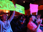 The Ask Me Another crowd cheers for a contestant during a taping at Brooklyn's Bell House in New York.