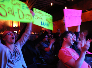 The Ask Me Another crowd cheers for a contestant during a taping at Brooklyn's Bell House in New York. The Ask Me Another crowd cheers for a contestant during a taping at Brooklyn's Bell House in New York.