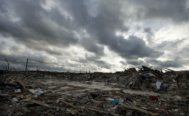 Storm clouds pass over the devastated Greenbriar Nursing Home in Joplin, Mo. on May 25, 2011. Eleven residents of the facility died when an EF-5 tornado tore through much of the city.