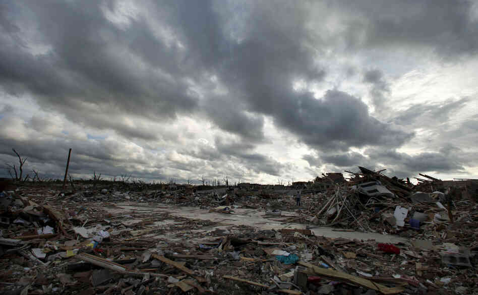 Storm clouds pass over the devastated Greenbriar Nursing Home in Joplin, Mo. on May 25, 2011. Eleven residents of the facility died when an EF-5 tornado tore through much of the city.