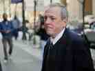 The Rev. James Brennan returns after a lunch break to Philadelphia Criminal Justice Center Mar. 26, 2012.