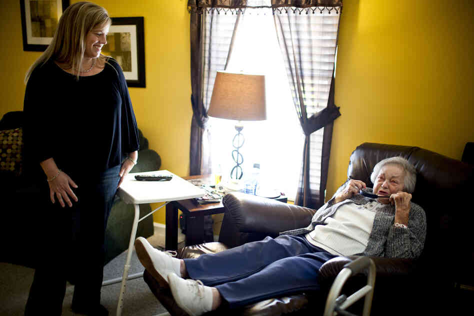 LaDonna Martin (left) shares full-time care of her grandmother-in-law, AnnaBelle Bowers, 87, with her sister-in-law, Kelley Hawkins. Both are nurses with two children each. AnnaBelle, who has limited mobility, moves every two weeks from one home to another.