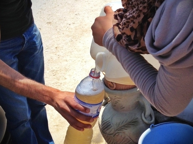 Filling up on legmi by the side of the road (NPR)
