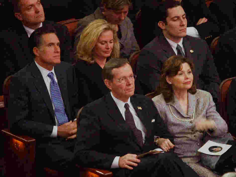 Mitt and Ann Romney sit behind Michael Leavitt and his wife Jacqueline at the February 2008 funeral of Gordon B. Hinckley, leader of the Church of Jesus Christ of Latter-day Saints. Romney reportedly has chosen Leavitt to lead his transition team.