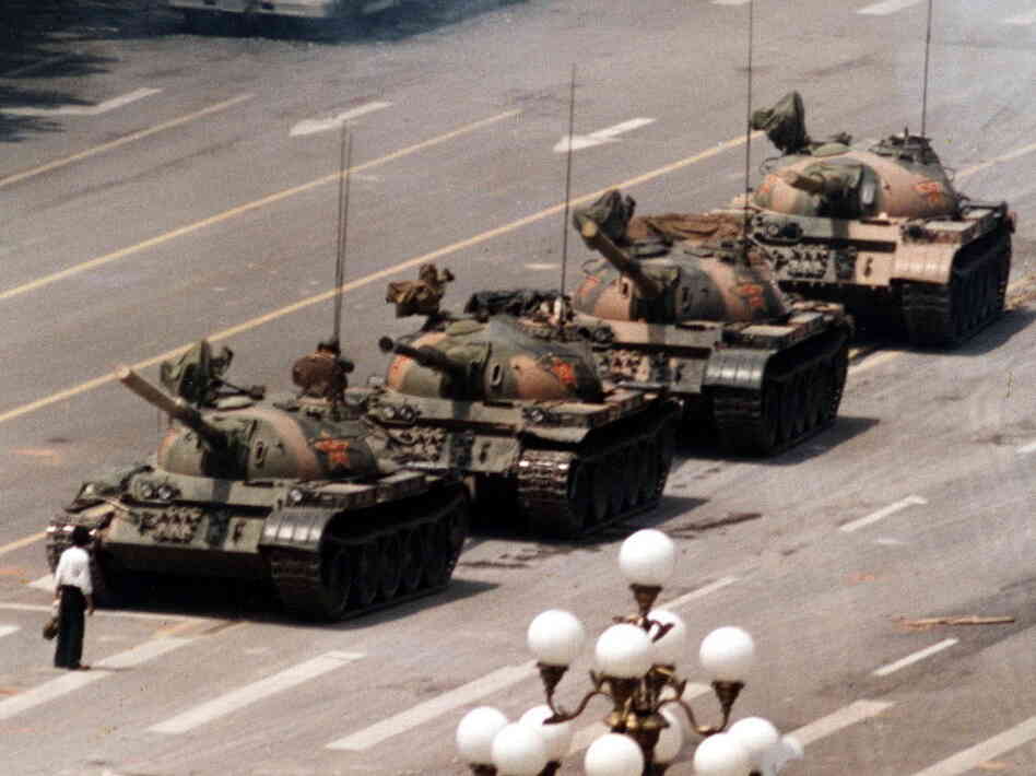 A Chinese protester, calling for an end to the violence against pro-democracy demonstrators at Tiananmen Square, blocks a line of tanks on June 5, 1989. A Chinese protester, calling for an end to the violence against pro-democracy demonstrators at Tiananmen Square, blocks a line of tanks on June 5, 1989.